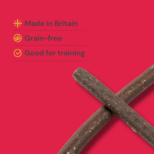 Dog treats on a red background with text indicating 'Made in Britain', 'Grain-free', and 'Good for training'.