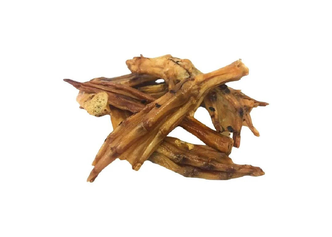 Close-up of natural air-dried duck feet dog treats from Maisey Daisey, showing texture and size variation.