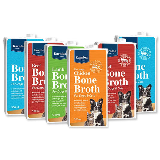 Six Karnlea bone broth liquid pouches for dogs and cats arranged in a fan shape on a white background. The pouches feature different flavor options: Blue (Beef), Red (Beef), Green (Lamb), Orange (Chicken), and Blue (Chicken).
