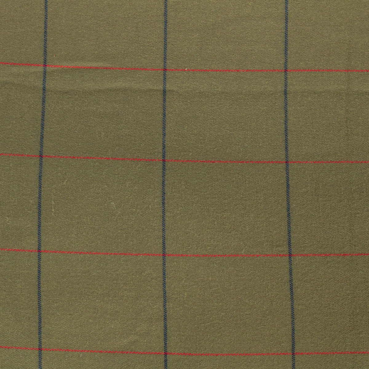 A close-up of olive green fabric with a subtle woven texture, featuring a windowpane plaid pattern with thin red horizontal stripes and dark blue vertical stripes.