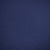 A close-up of a dark blue textured fabric surface.