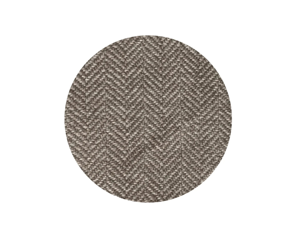 A circular fabric swatch showing a textured herringbone weave in a blend of taupe, brown, and gray tones, centered on a solid white background.