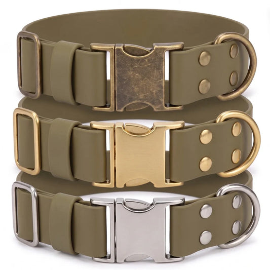 Three olive green dog collars stacked vertically, each with a different metal buckle and D-ring finish: antique bronze, gold, and silver.