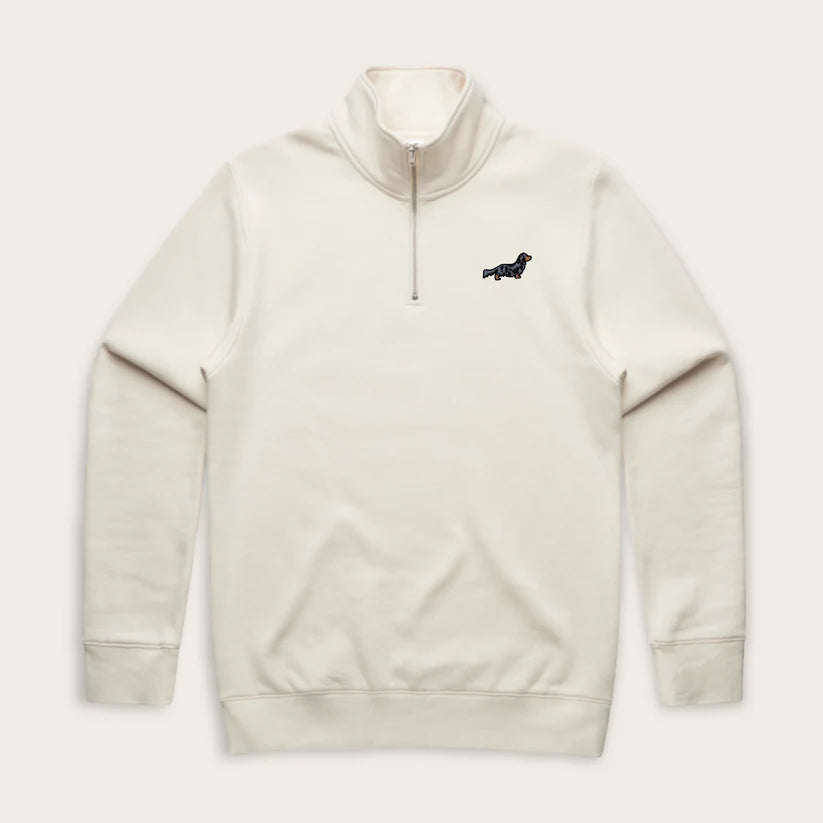 An off-white quarter-zip pullover sweatshirt with a small black dog logo on the left chest, displayed against a matching off-white background.