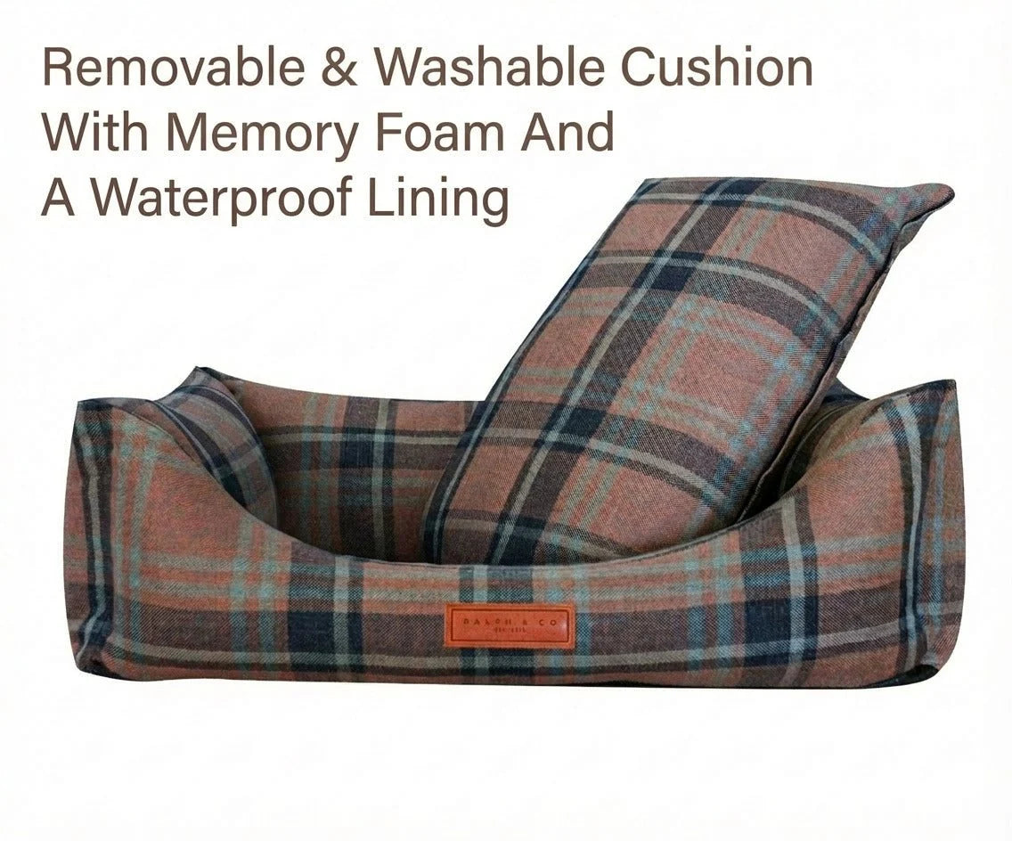 Plaid patterned pet bed with memory foam and waterproof lining on a white background