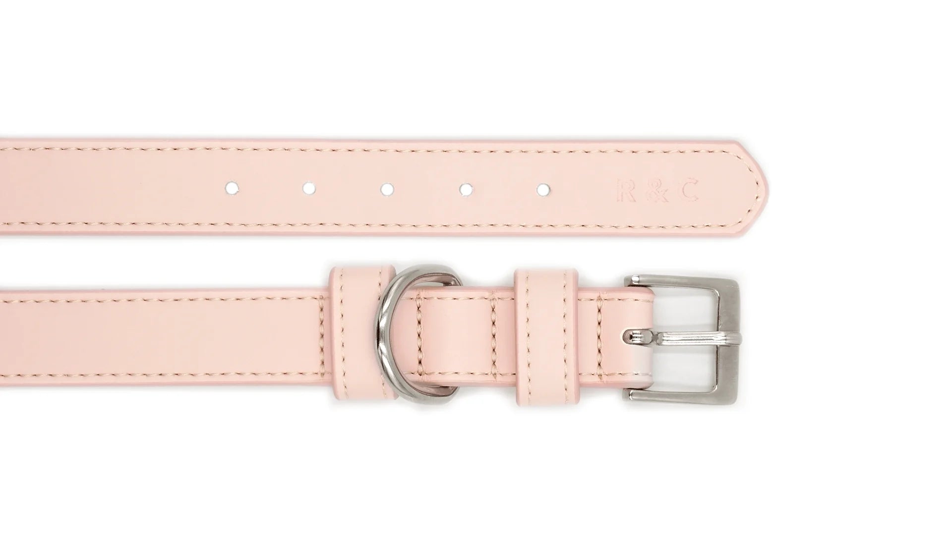 A light pink faux leather collar strap shown from two angles on a white background, featuring a silver-tone buckle and a silver-tone loop.